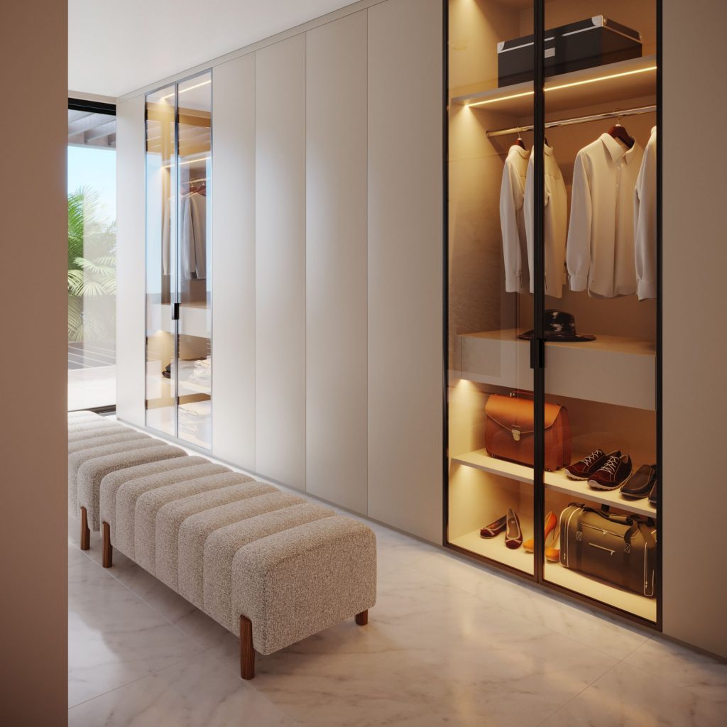 Walk-in closet pensado para uma rotina partilhada de casal.