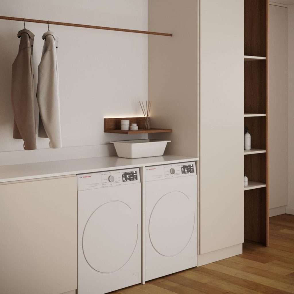 Lavandaria com uma bancada espaçosa para dobrar e tratar de roupas.