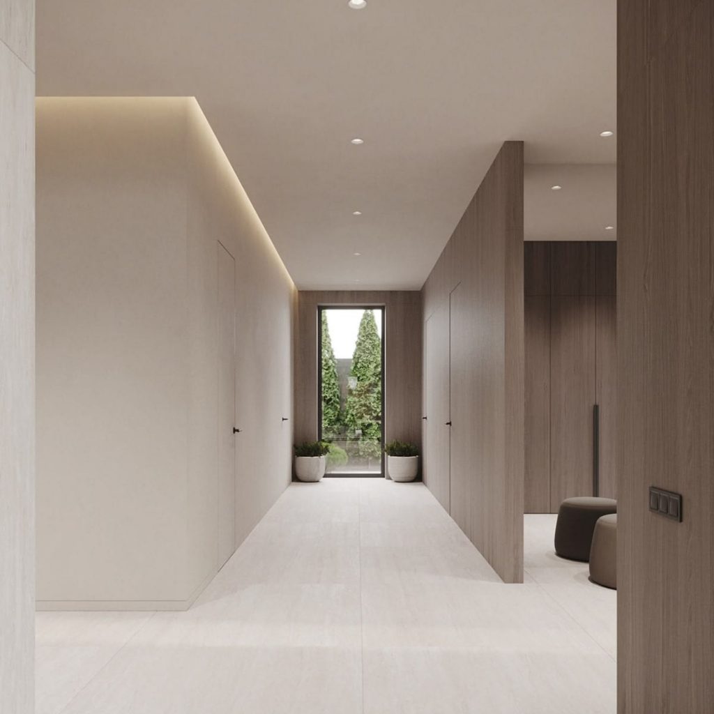 Corredor minimalista onde superfícies desimpedidas reforçam uma decoração clara e funcional, permitindo que as emoções se alinhem com a serenidade do espaço. A luz suave evidencia a intenção da arquitetura em criar percursos fluidos, revelando como a decoração pode organizar o quotidiano através de silêncio visual. Cada detalhe contribui para uma atmosfera equilibrada, onde as emoções emergem da simplicidade e onde a arquitetura se articula com uma decoração que privilegia ordem e bem‑estar, moldando emoções de leveza e clareza.