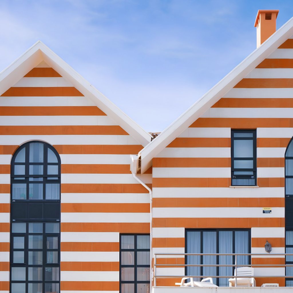 Fachada contemporânea que remete para a estética das casas típicas da Costa Nova, reinterpretando os padrões icónicos dos palheiros da Costa Nova com uma abordagem moderna que inspira Design de Interiores e evoca o ambiente de Casa de praia; As linhas horizontais reforçam a ligação às Casas às riscas aveiro, destacando a identidade de cada casa aveiro e os vibrantes Colores de casa associados às Aveiro casas coloridas; A composição volta a celebrar as Casas Típicas da Costa Nova, articulando a tradição dos Palheiros da Costa Nova com a atmosfera de Casa de praia, criando paralelos com soluções de Design de Interiores; A geometria marcada intensifica a referência às Casas às riscas aveiro, à autenticidade de cada Casa aveiro e aos expressivos Colores de casa presentes nas Aveiro casas coloridas; O enquadramento final reforça novamente as Casas Típicas da Costa Nova, os Palheiros da Costa Nova, o espírito de Casa de praia, a inspiração de Design de Interiores, e a força visual das Casas às riscas aveiro, das Casa aveiro, dos Colores de casa e das Aveiro casas coloridas.