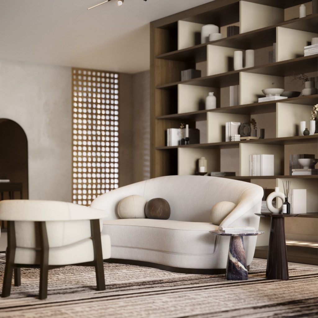 Sala de estar e biblioteca em casa com sofisticada estante aberta com estantes para livros, sofá curvo claro, cadeirão de apoio e apontamentos de decoração minimalista assinados por design de interiores.